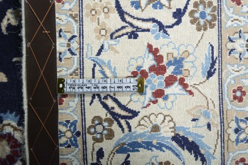 Backside of handmade 2000s Nain rug showing knot structure and weave density