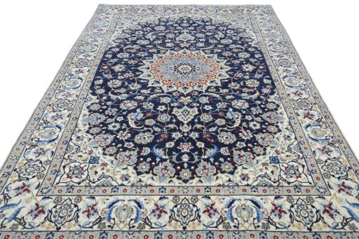 Surface texture of 2000s Nain rug with natural Wool and intricate pattern
