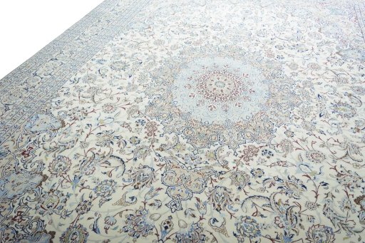Backside of handmade New Nain rug showing knot structure and weave density