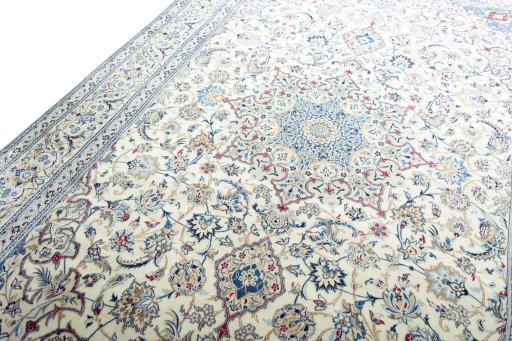 Backside of handmade New Nain rug showing knot structure and weave density