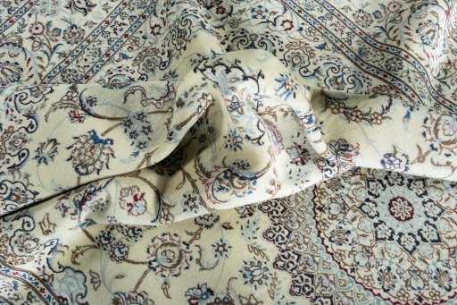 Surface texture of 2000s Nain rug with natural Cork and intricate pattern