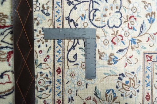 Backside of handmade 2000s Nain rug showing knot structure and weave density