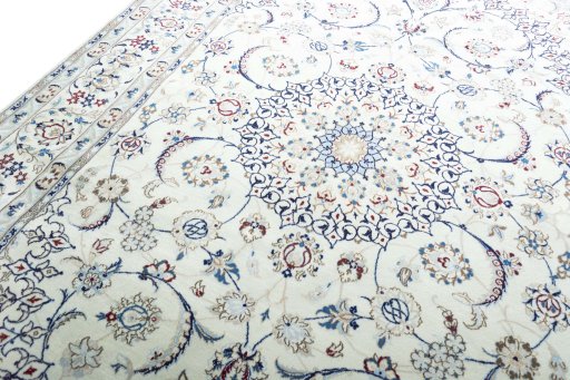 Backside of handmade New Nain rug showing knot structure and weave density