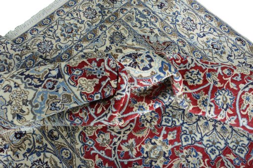 Surface texture of 2000s Nain rug with natural Wool and intricate pattern