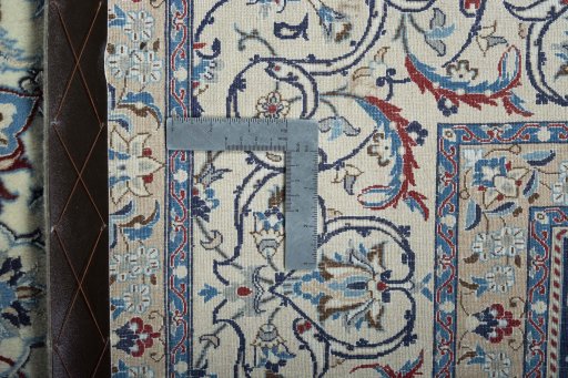 Backside of handmade New Nain rug showing knot structure and weave density