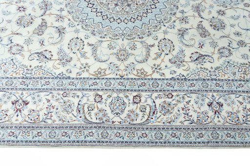 Corner detail of New Nain rug showing border pattern and Cork pile