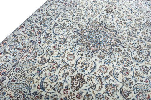 Backside of handmade New Nain rug showing knot structure and weave density