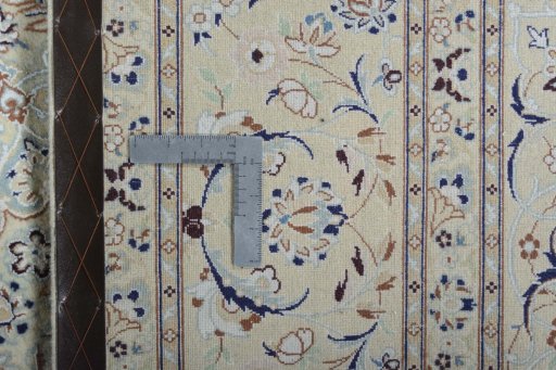 Backside of handmade New Nain rug showing knot structure and weave density