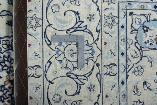 Backside of handmade New Nain rug showing knot structure and weave density