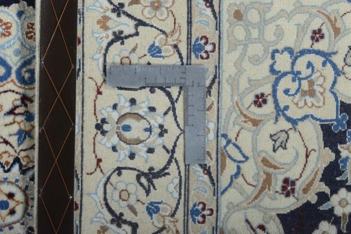 Backside of handmade New Nain rug showing knot structure and weave density
