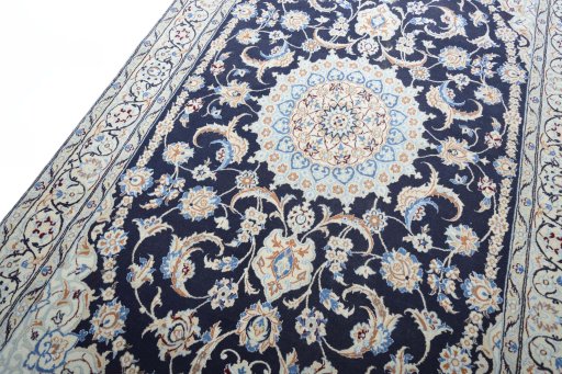 Backside of handmade New Nain rug showing knot structure and weave density