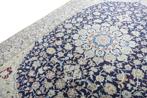 Backside of handmade New Nain rug showing knot structure and weave density
