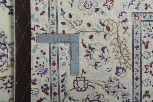 Backside of handmade New Nain rug showing knot structure and weave density