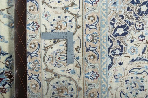 Backside of handmade New Nain rug showing knot structure and weave density