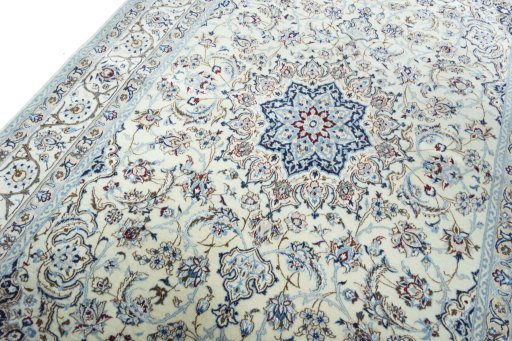 Backside of handmade New Nain rug showing knot structure and weave density