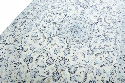 Backside of handmade New Nain rug showing knot structure and weave density