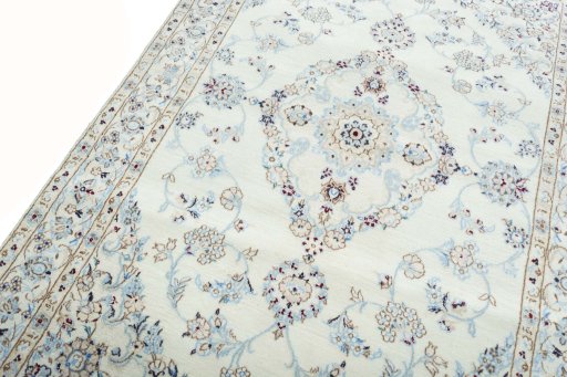 Backside of handmade New Nain rug showing knot structure and weave density