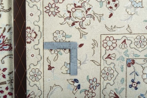 Backside of handmade New Nain rug showing knot structure and weave density