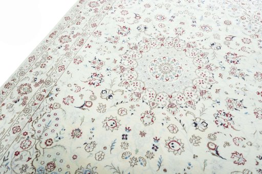 Backside of handmade New Nain rug showing knot structure and weave density