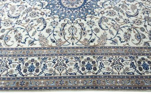 Corner detail of 2000s Nain rug showing border pattern and Wool pile
