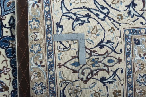 Backside of handmade 2000s Nain rug showing knot structure and weave density
