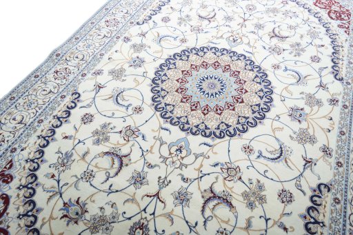 Backside of handmade New Nain rug showing knot structure and weave density