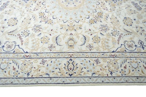 Corner detail of New Nain rug showing border pattern and Wool pile