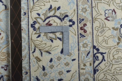 Backside of handmade New Nain rug showing knot structure and weave density