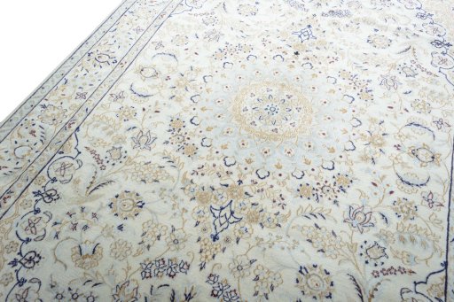 Backside of handmade New Nain rug showing knot structure and weave density