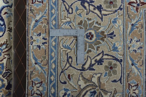 Backside of handmade New Nain rug showing knot structure and weave density