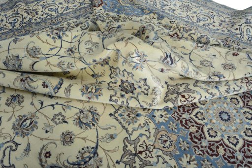 Backside of handmade New Nain rug showing knot structure and weave density