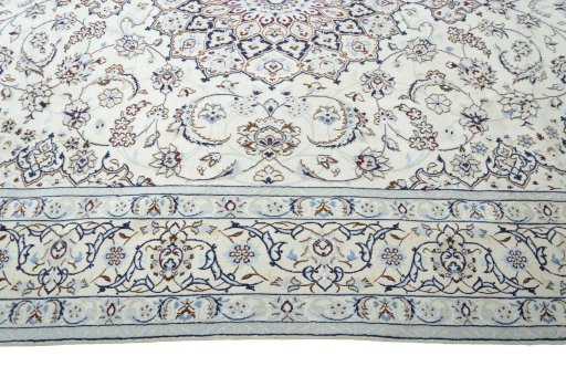 Corner detail of New Nain rug showing border pattern and Wool pile