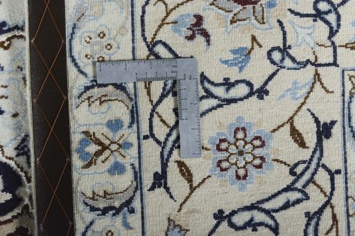 Backside of handmade New Nain rug showing knot structure and weave density