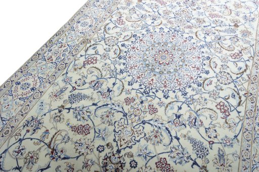 Backside of handmade New Nain rug showing knot structure and weave density