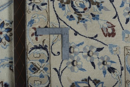 Backside of handmade New Nain rug showing knot structure and weave density