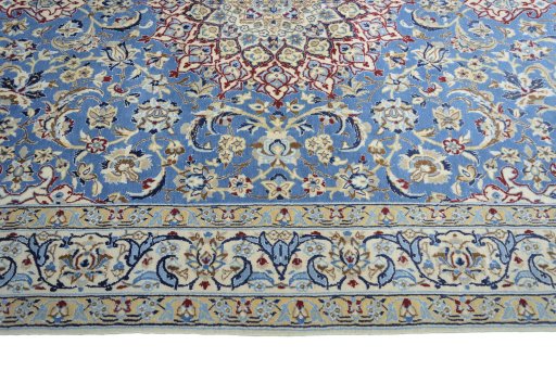 Corner detail of 2000s Nain rug showing border pattern and Wool pile