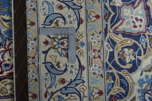 Backside of handmade 2000s Nain rug showing knot structure and weave density