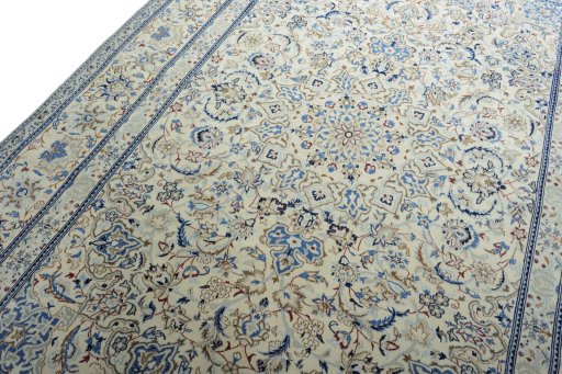 Backside of handmade New Nain rug showing knot structure and weave density
