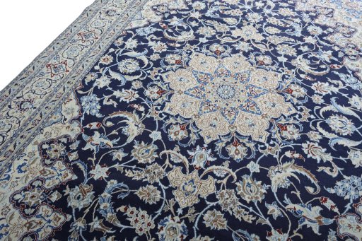 Backside of handmade New Nain rug showing knot structure and weave density