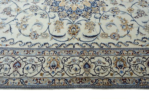 Corner detail of New Nain rug showing border pattern and Wool pile
