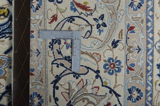 Backside of handmade New Nain rug showing knot structure and weave density