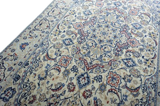 Backside of handmade New Nain rug showing knot structure and weave density