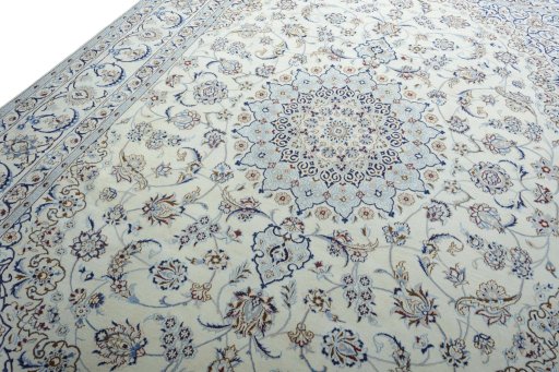 Backside of handmade New Nain rug showing knot structure and weave density