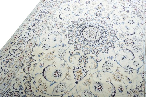 Backside of handmade New Nain rug showing knot structure and weave density