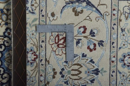 Backside of handmade New Nain rug showing knot structure and weave density