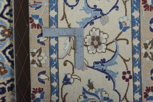 Backside of handmade New Nain rug showing knot structure and weave density