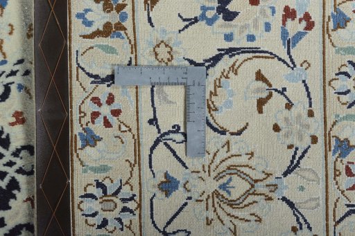 Backside of handmade New Nain rug showing knot structure and weave density