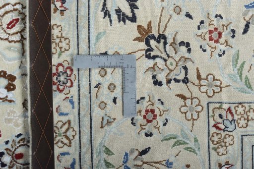 Backside of handmade New Nain rug showing knot structure and weave density