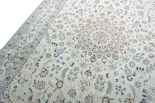Backside of handmade New Nain rug showing knot structure and weave density