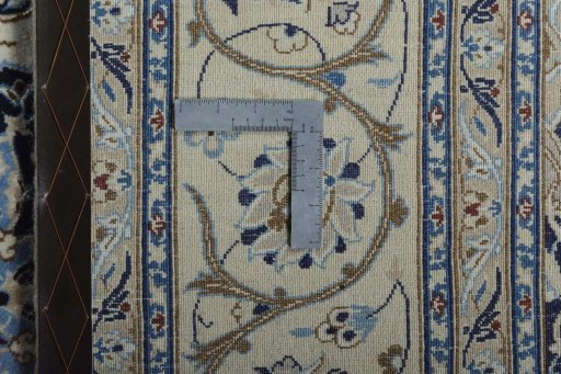 Backside of handmade New Nain rug showing knot structure and weave density